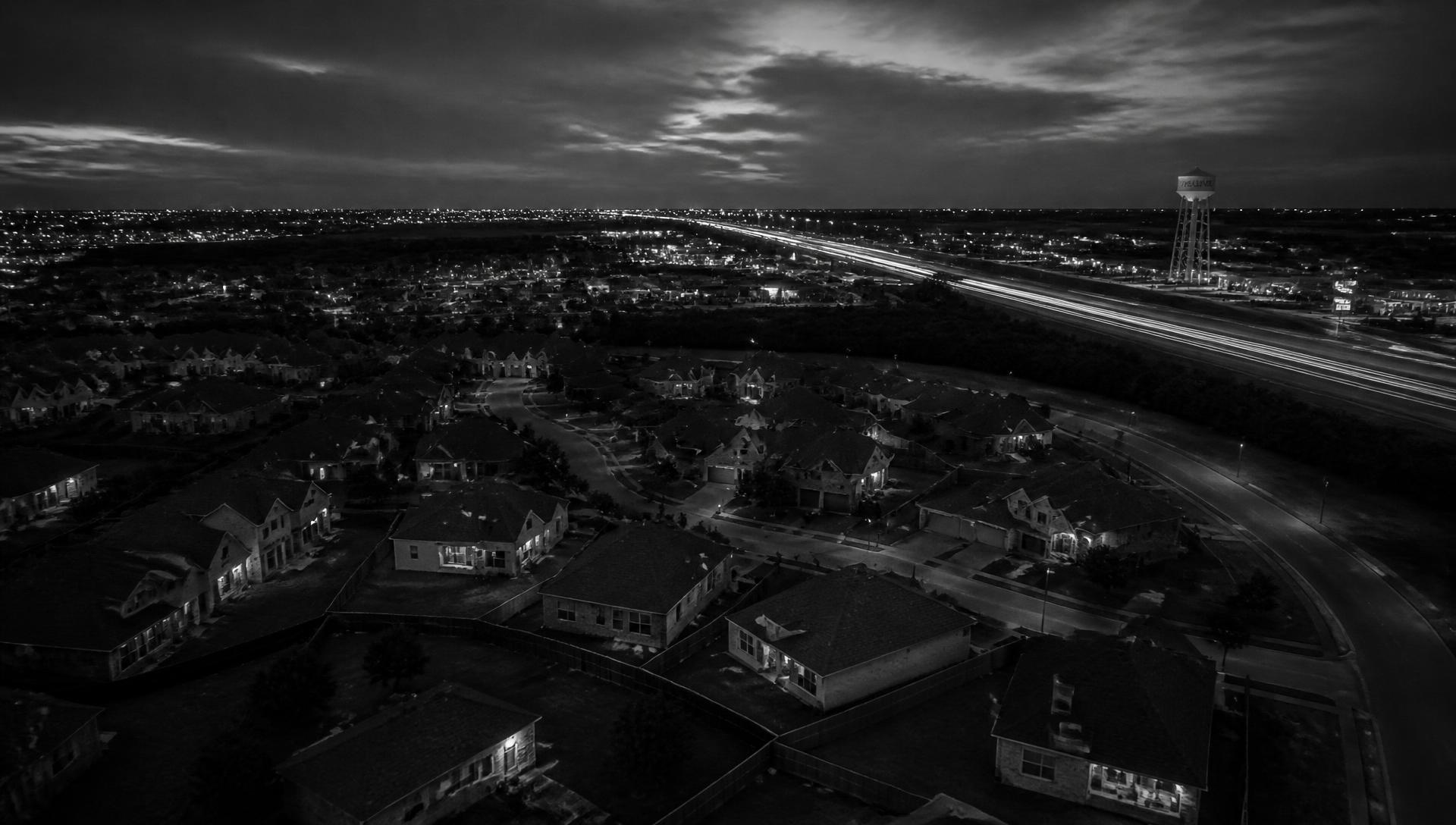 Aerial view of a Williamson County neighborhood along the I-35 corridor at dusk